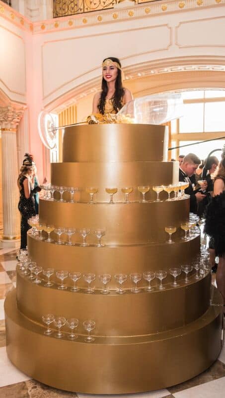 The guests were welcomed with Bellinis, served in old fashioned Champagne coupes, from an enormous Champagne Tower